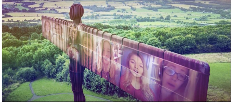 Image from film showing Angel Of The North with singers faces superimposed on it's outstretched wings