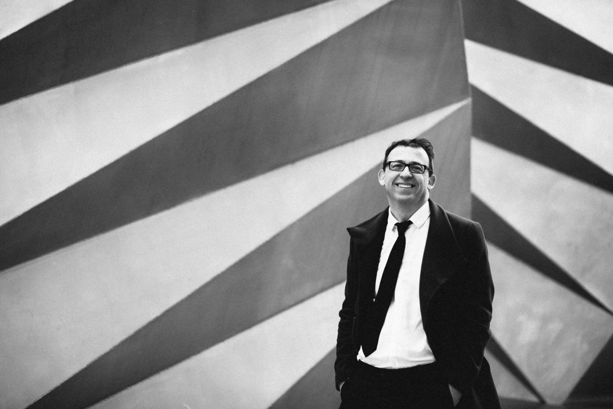 Will Todd standing in front of 3D monochrome print wall